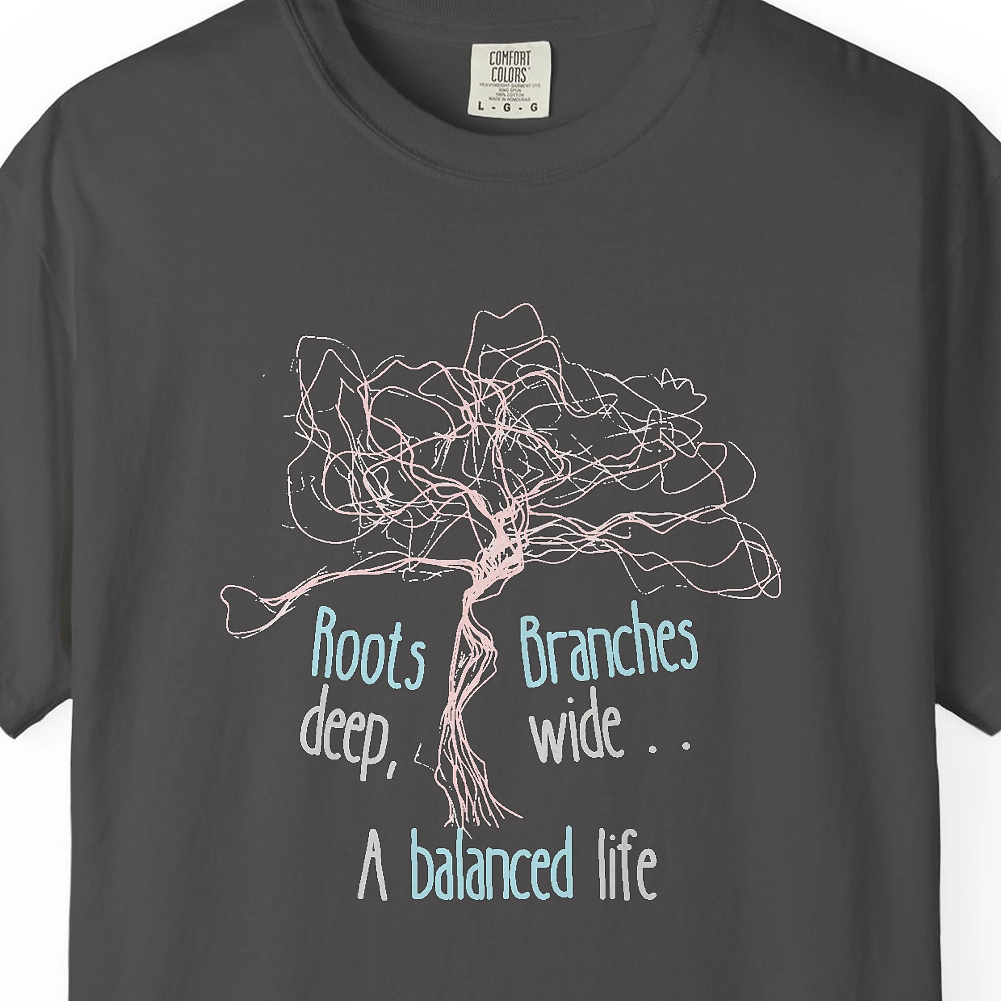 Close-up of the A Balanced Life print on a Graphite Comfort Colors 1717 tee