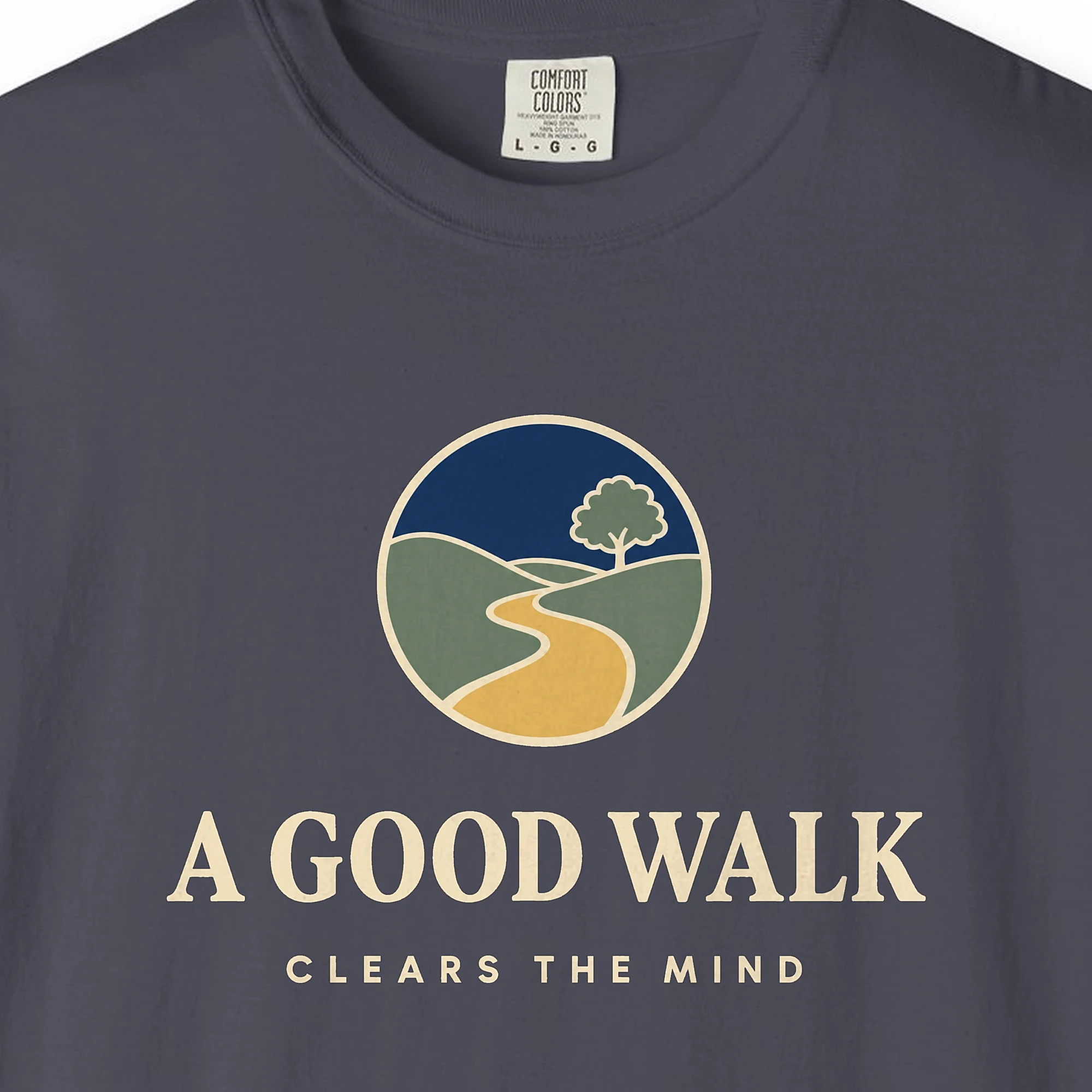 a-good-walk-tee-navy-chest Close-up of the A Good Walk print on a Navy Comfort Colors 1717 tee
