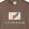 Close-up of the A Letter by Hand print on a Espresso Comfort Colors 1717 tee