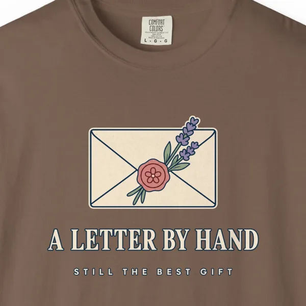 Close-up of the A Letter by Hand print on a Espresso Comfort Colors 1717 tee