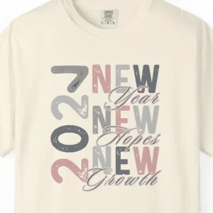 Close-up of the A Year of New Dreams print on a Ivory Comfort Colors 1717 tee