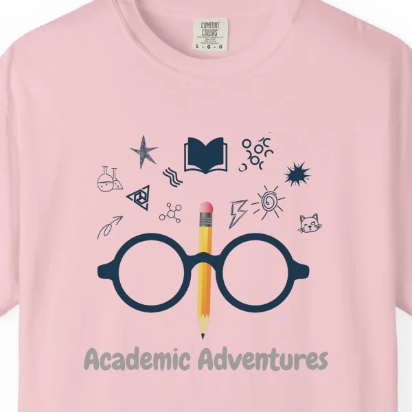 Close-up of the Academic Adventures print on a Blossom Comfort Colors 1717 tee