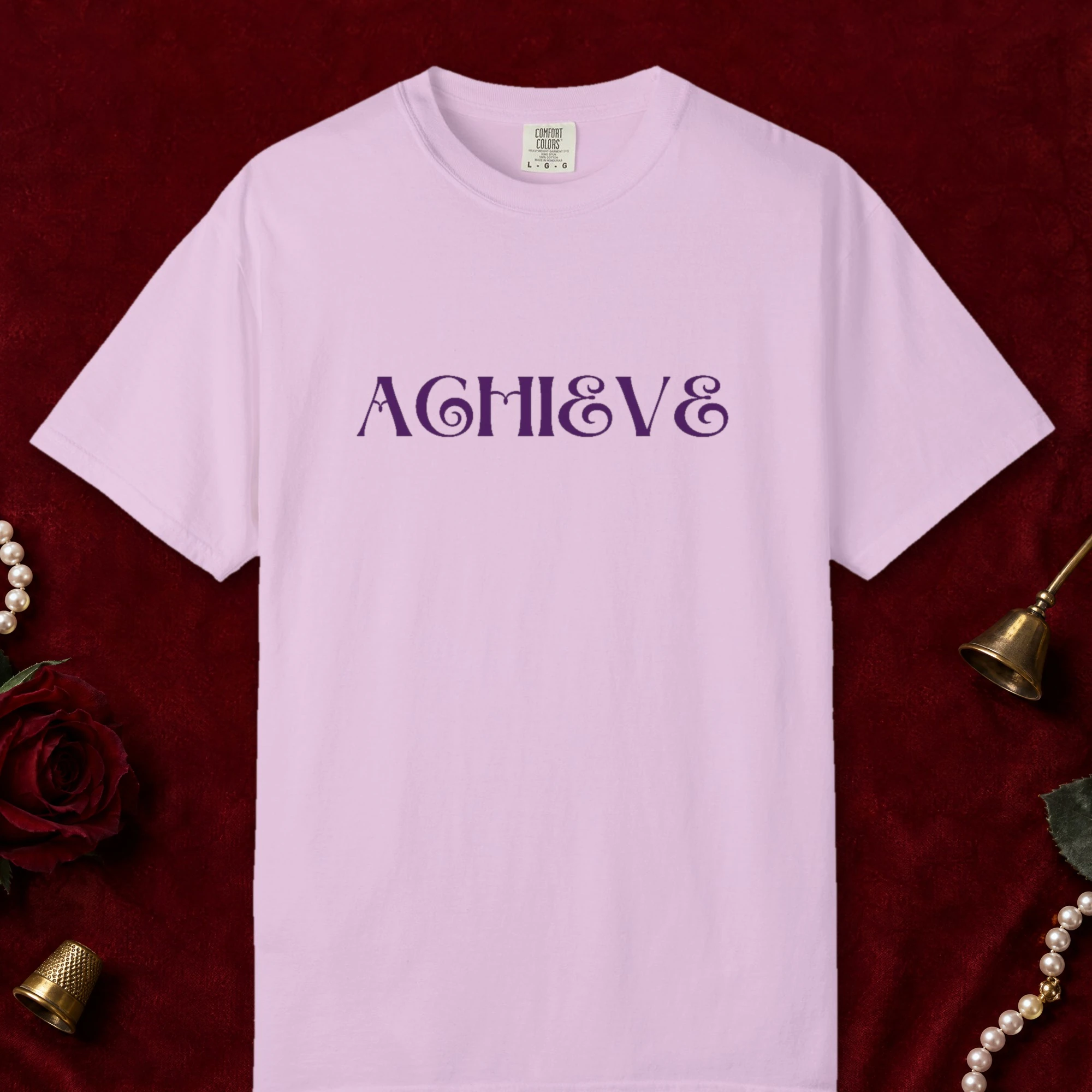 Achieve design on a Orchid Comfort Colors 1717 tee, laid flat