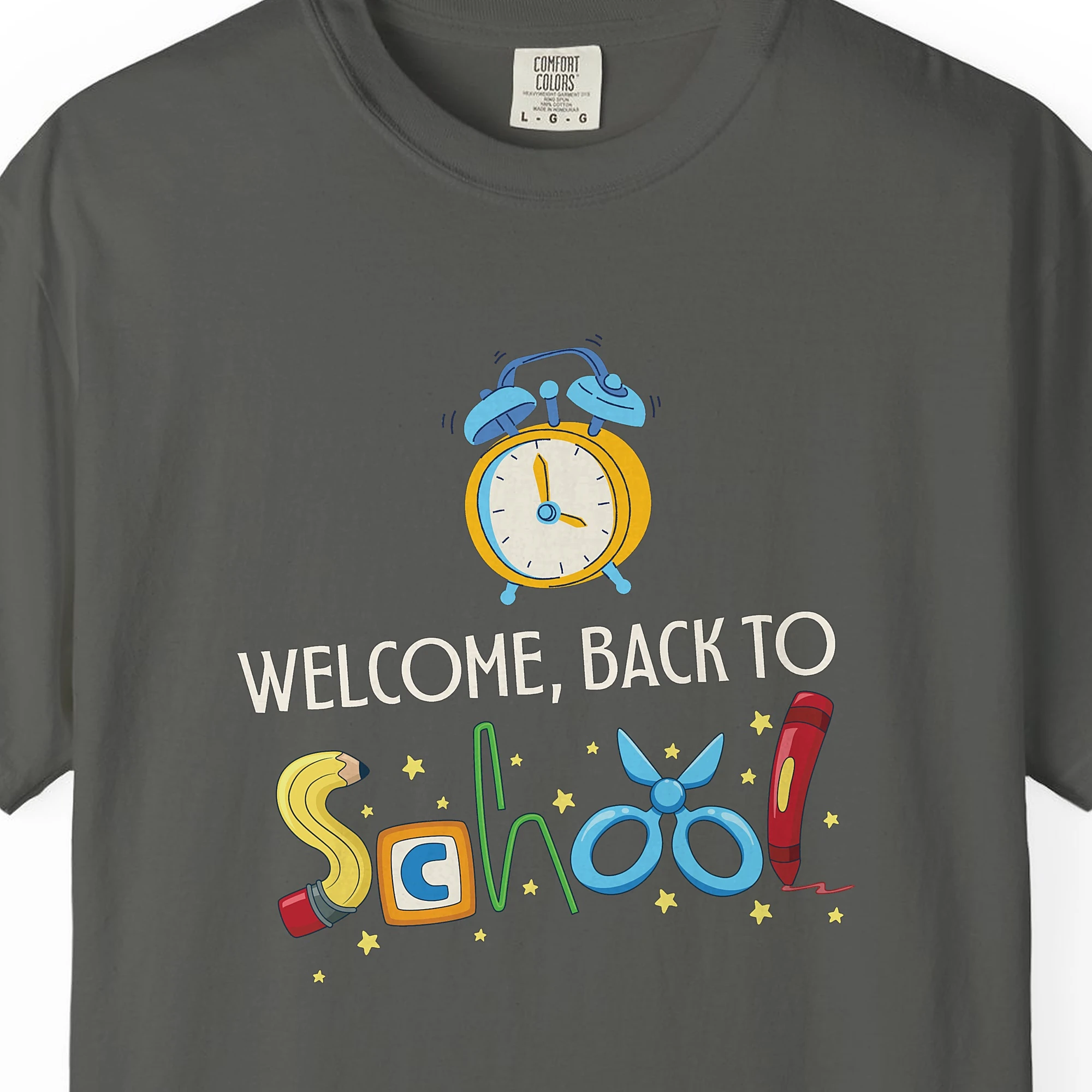 Close-up of the Alarm Clock Welcome print on a Pepper Comfort Colors 1717 tee