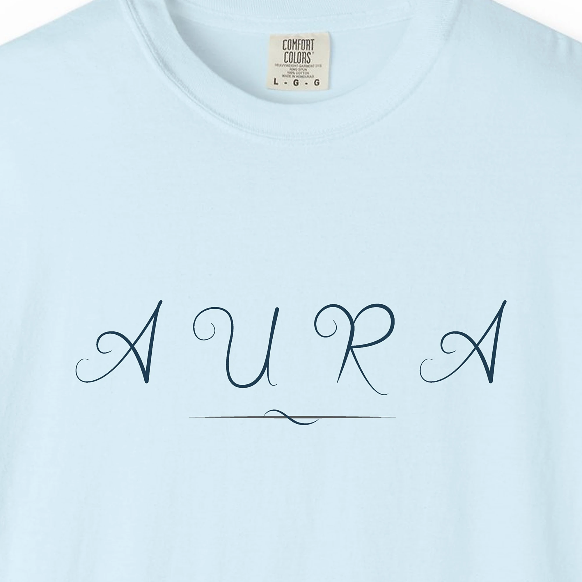 Close-up of the Aura Swash print on a Chambray Comfort Colors 1717 tee