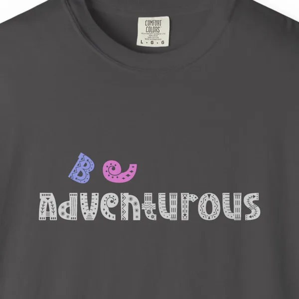 Close-up of the Be Adventurous print on a Graphite Comfort Colors 1717 tee