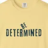 Close-up of the Be Determined print on a Butter Comfort Colors 1717 tee