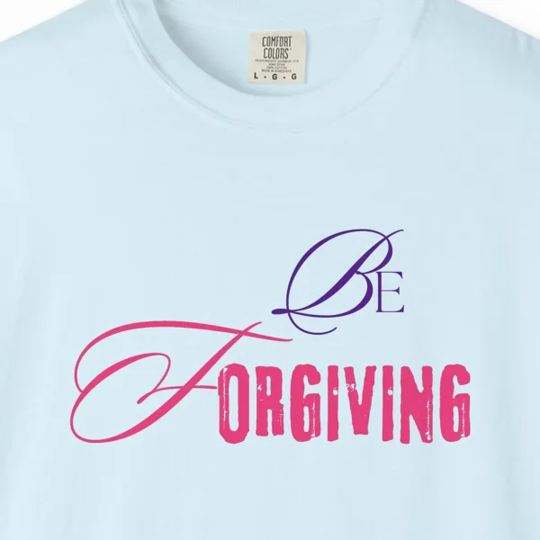 Close-up of the Be Forgiving print on a Chambray Comfort Colors 1717 tee