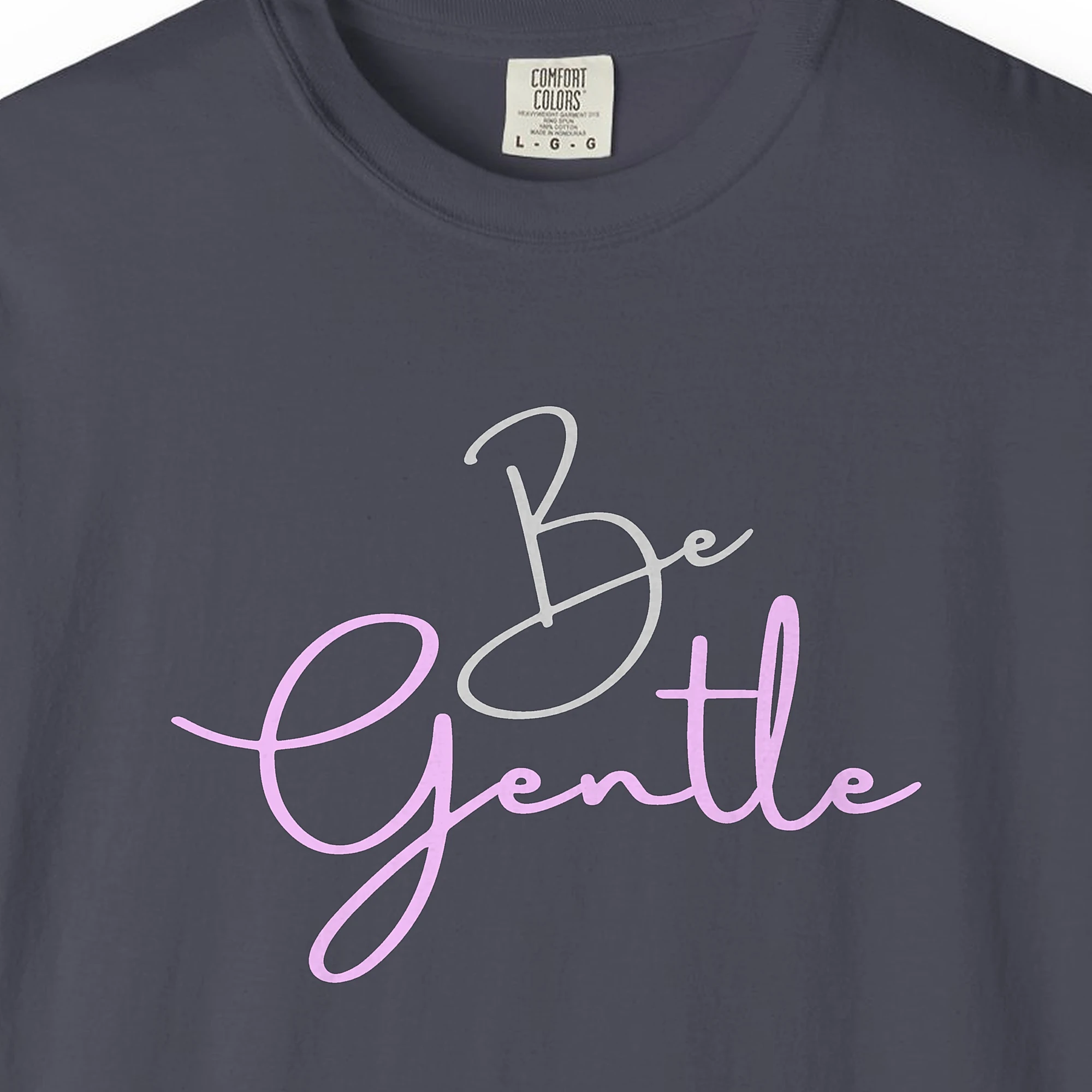 Close-up of the Be Gentle print on a Navy Comfort Colors 1717 tee