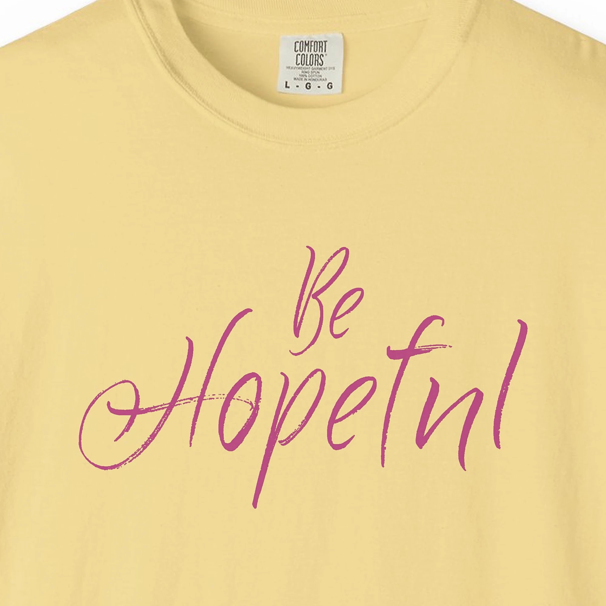 Close-up of the Be Hopeful print on a Butter Comfort Colors 1717 tee