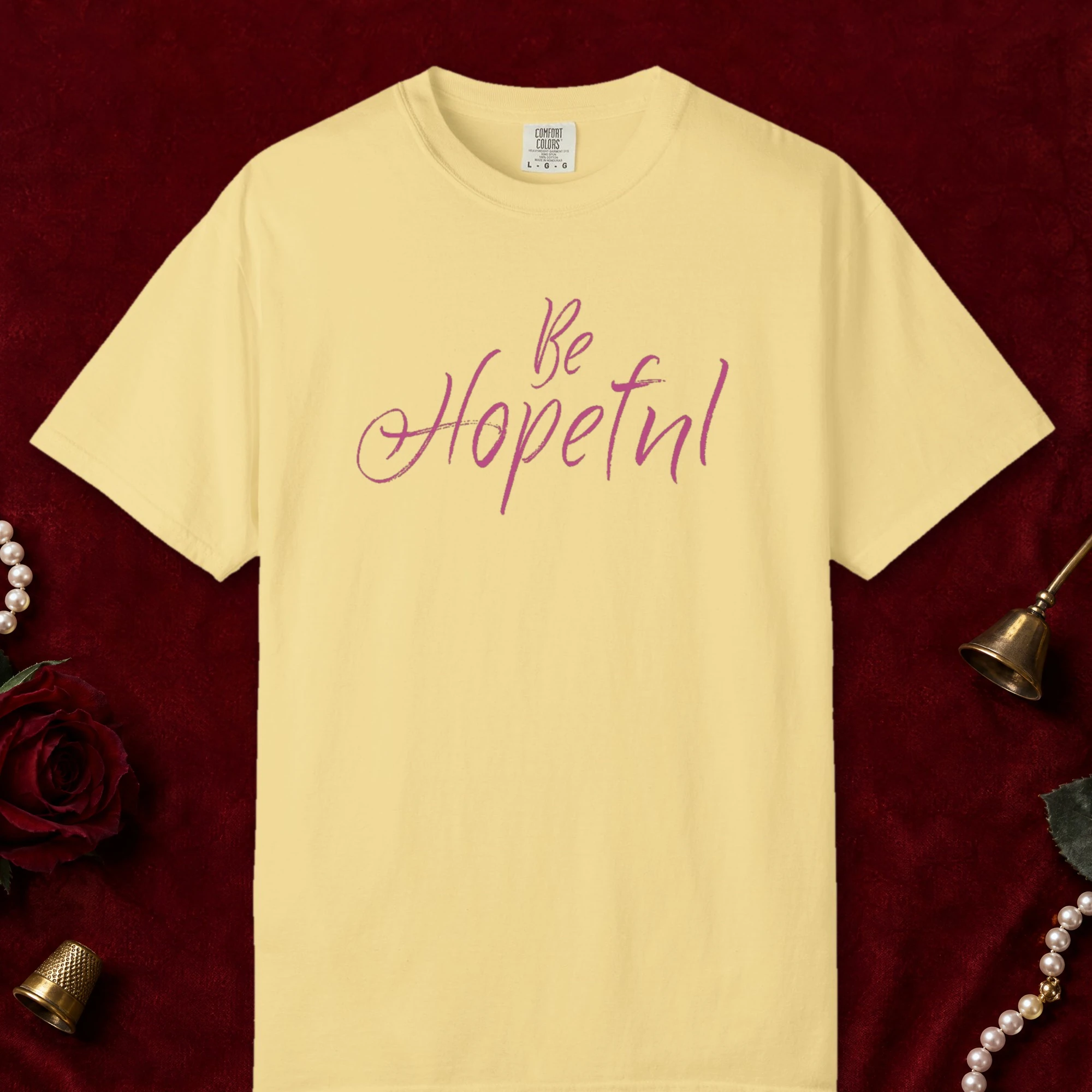 Be Hopeful design on a Butter Comfort Colors 1717 tee, laid flat