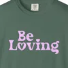 be-loving-tee-blue-spruce-chest Close-up of the Be Loving print on a Blue Spruce Comfort Colors 1717 tee
