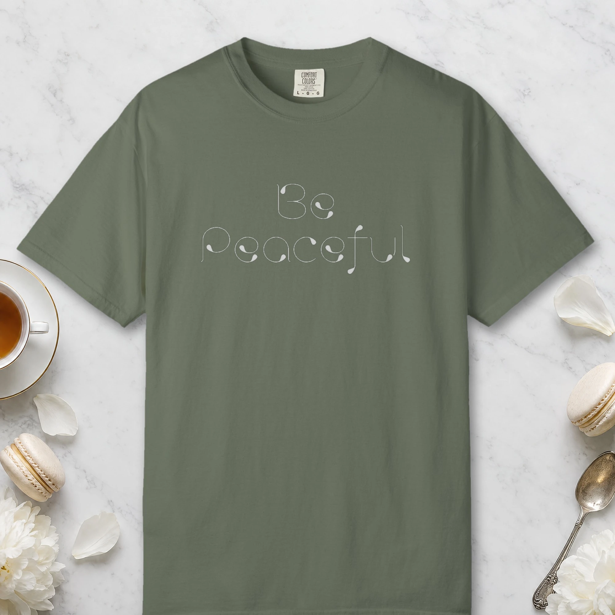 Be Peaceful design on a Moss Comfort Colors 1717 tee, laid flat