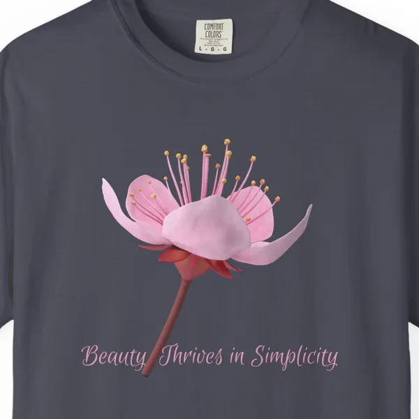 Close-up of the Beauty Thrives in Simplicity print on a Navy Comfort Colors 1717 tee