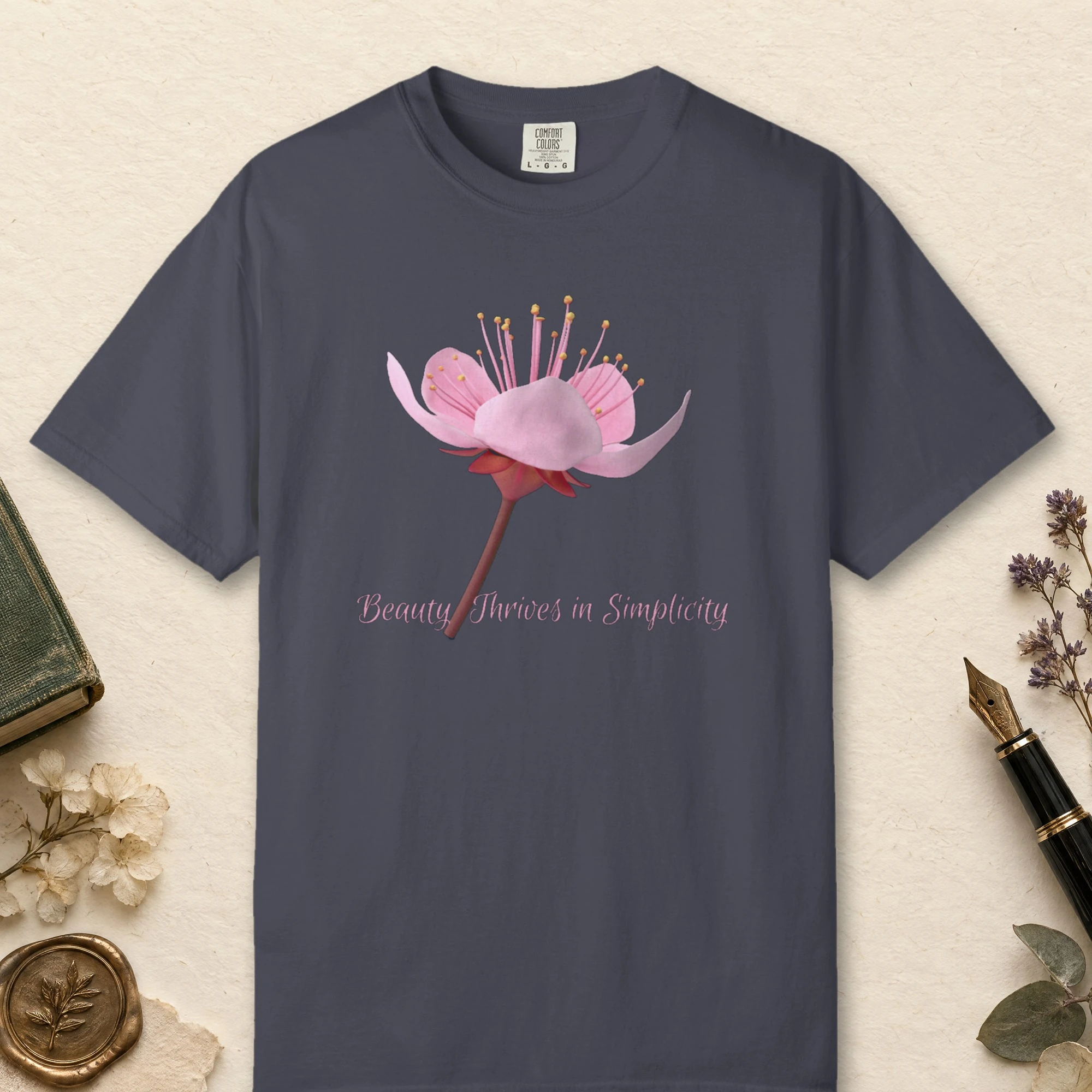 Beauty Thrives in Simplicity design on a Navy Comfort Colors 1717 tee, laid flat