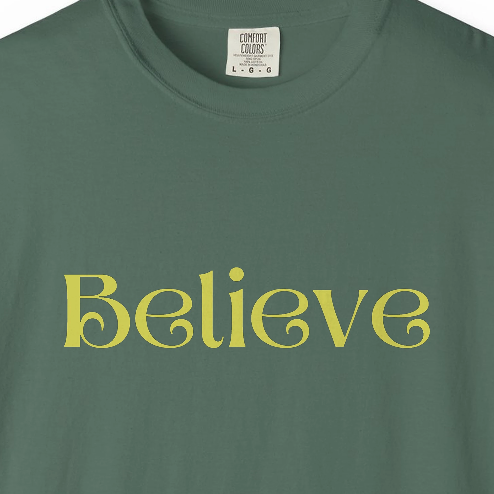 believe-tee-blue-spruce-chest Close-up of the Believe print on a Blue Spruce Comfort Colors 1717 tee