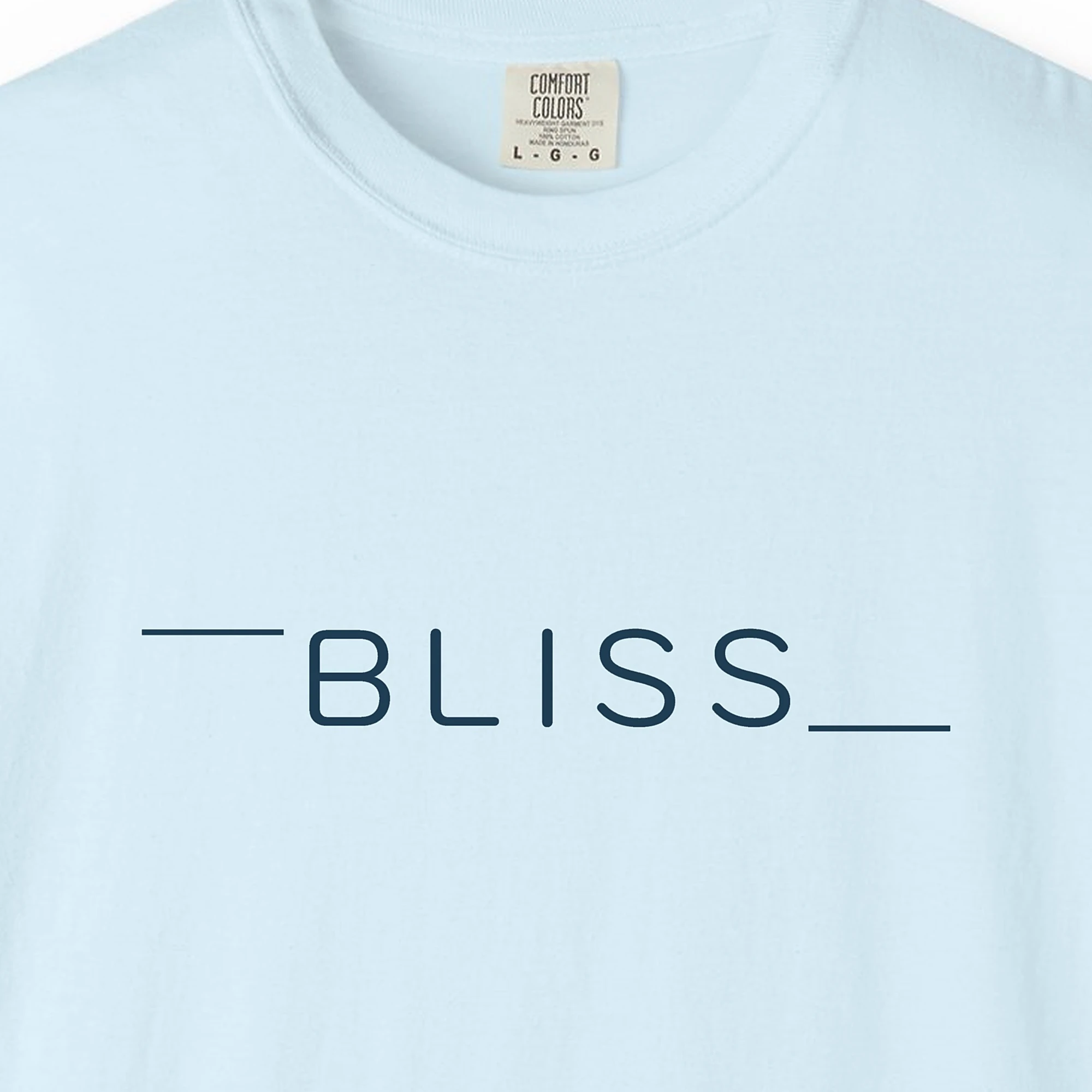 Close-up of the Bliss Between Lines print on a Chambray Comfort Colors 1717 tee