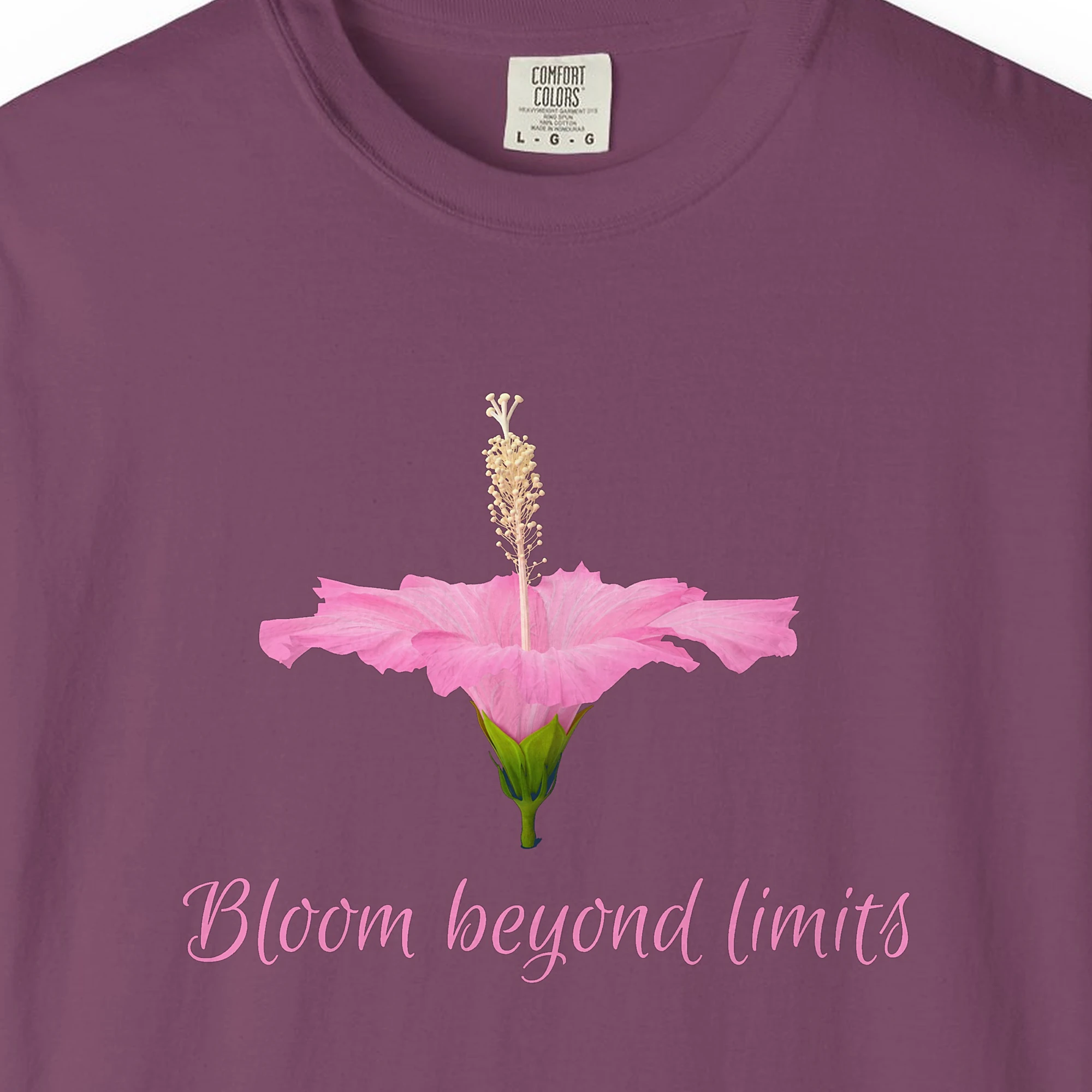 Close-up of the Bloom Beyond Limits print on a Berry Comfort Colors 1717 tee