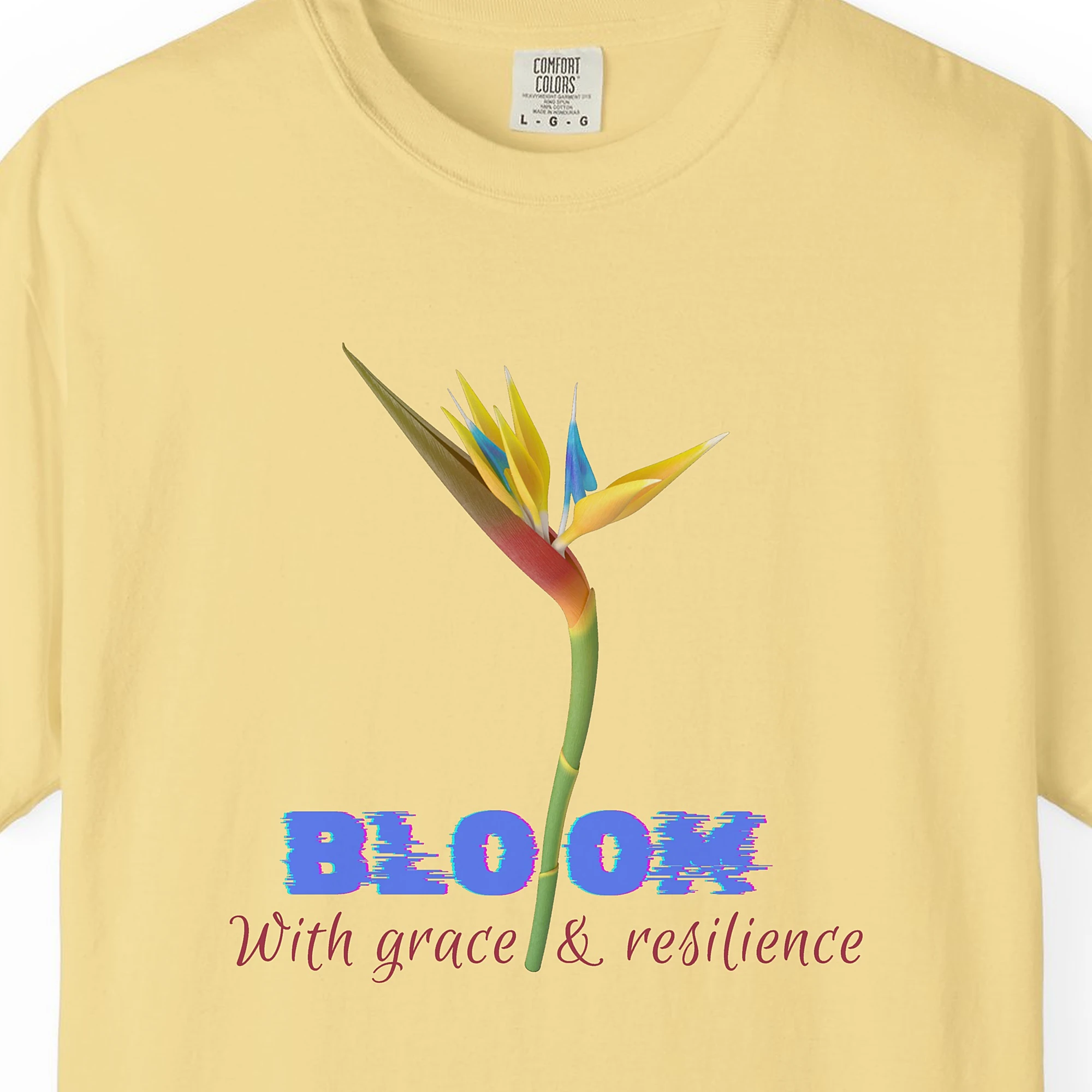 Close-up of the Bloom with Grace print on a Butter Comfort Colors 1717 tee