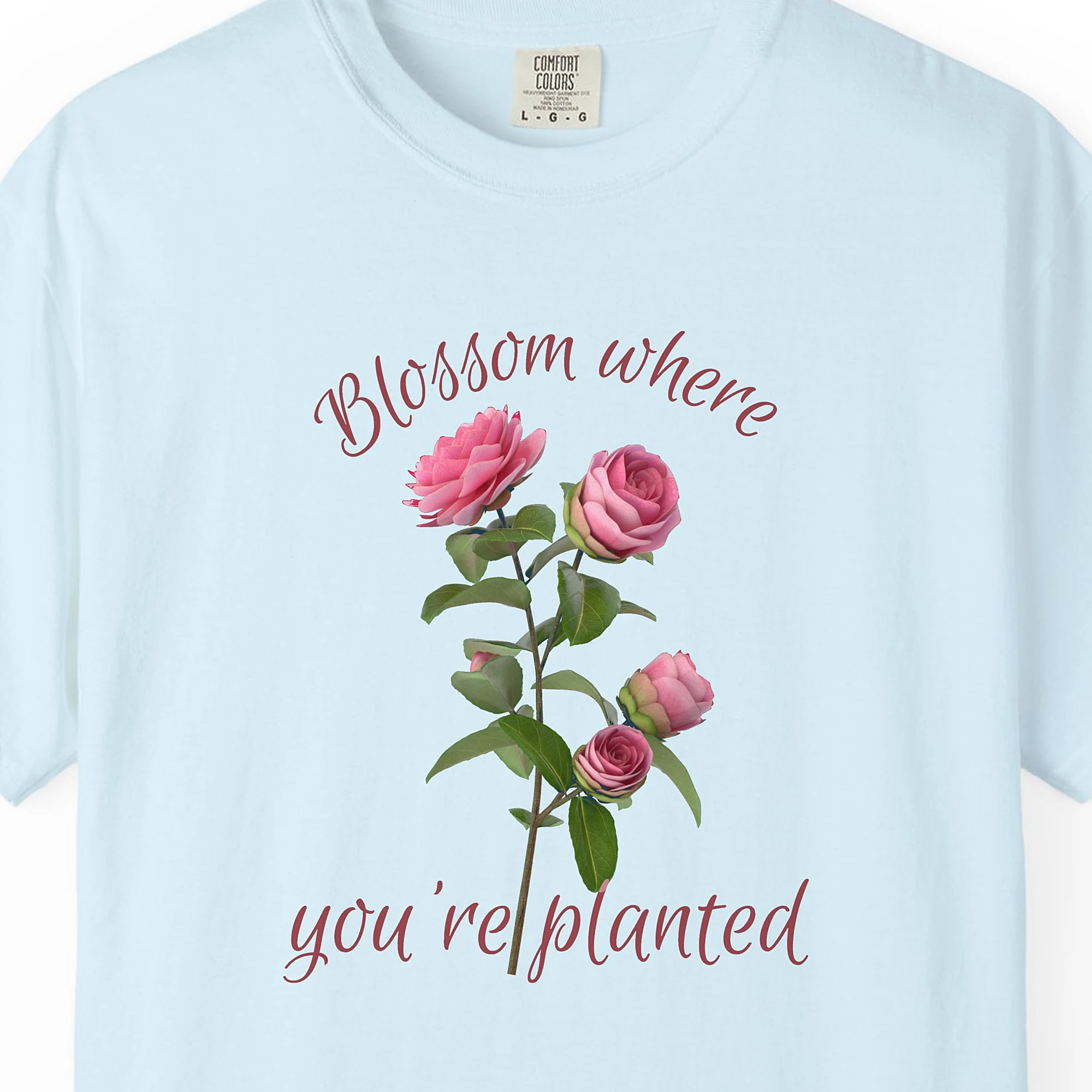 Close-up of the Blossom Where Planted print on a Chambray Comfort Colors 1717 tee