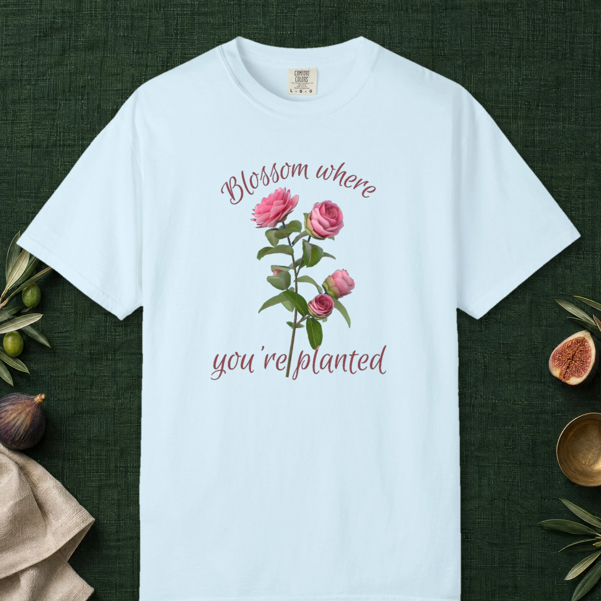 Blossom Where Planted design on a Chambray Comfort Colors 1717 tee, laid flat
