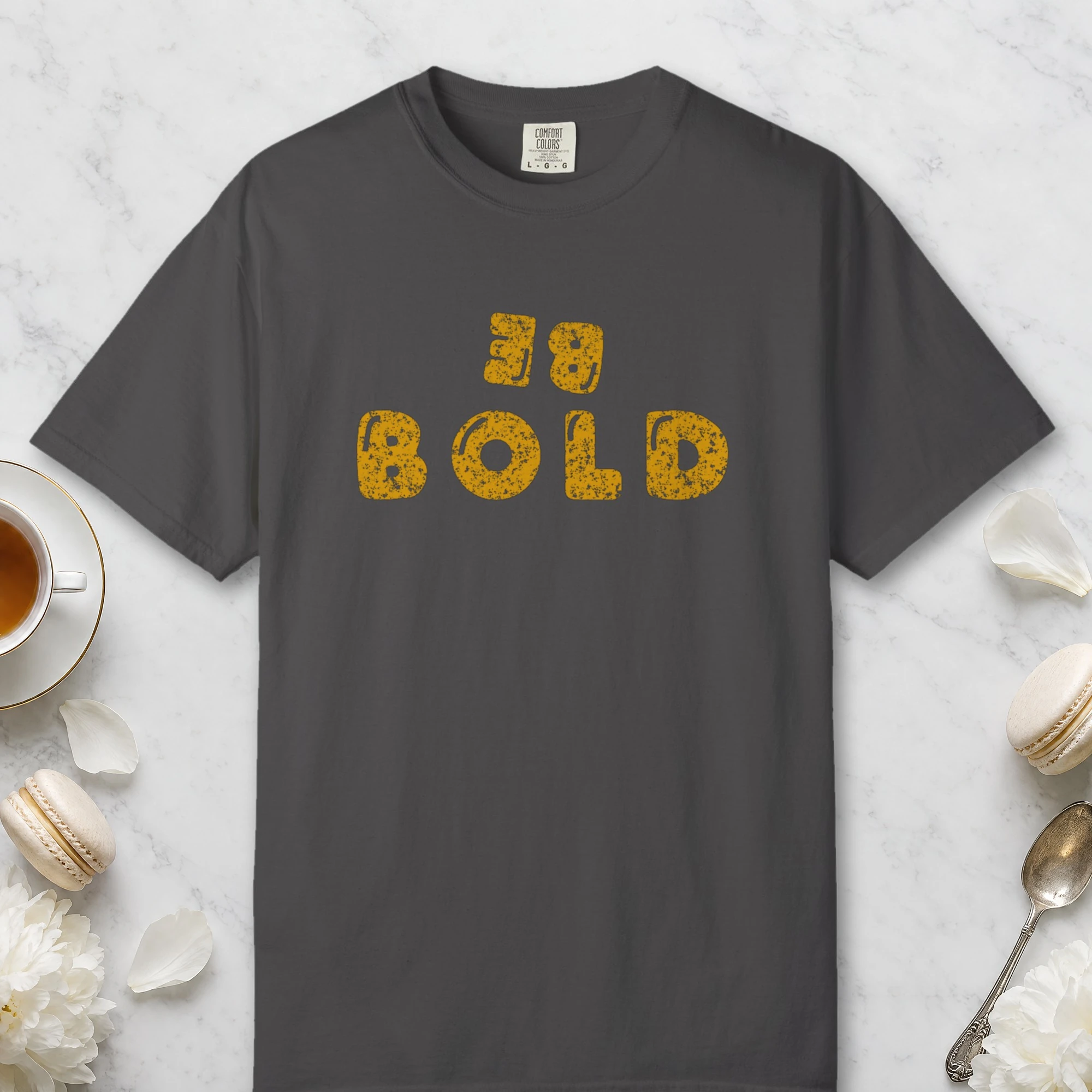 Bold at Heart design on a Graphite Comfort Colors 1717 tee, laid flat