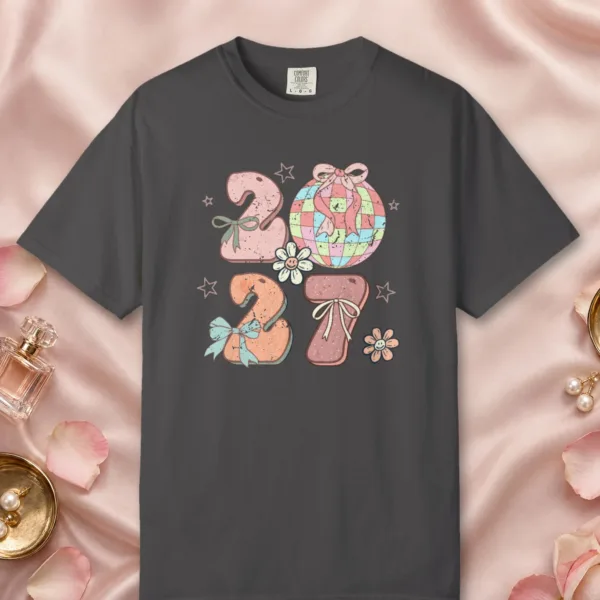 Bows and Disco Ball design on a Graphite Comfort Colors 1717 tee, laid flat