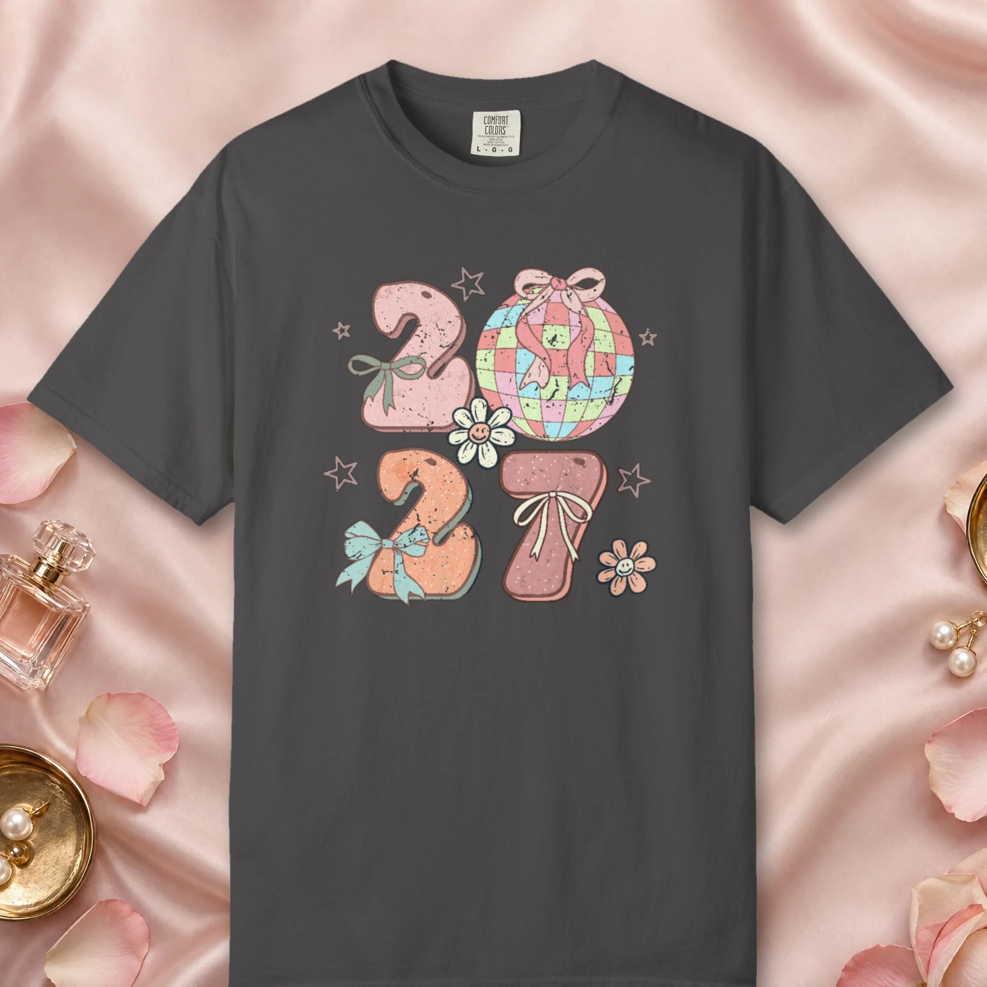 Bows and Disco Ball design on a Graphite Comfort Colors 1717 tee, laid flat