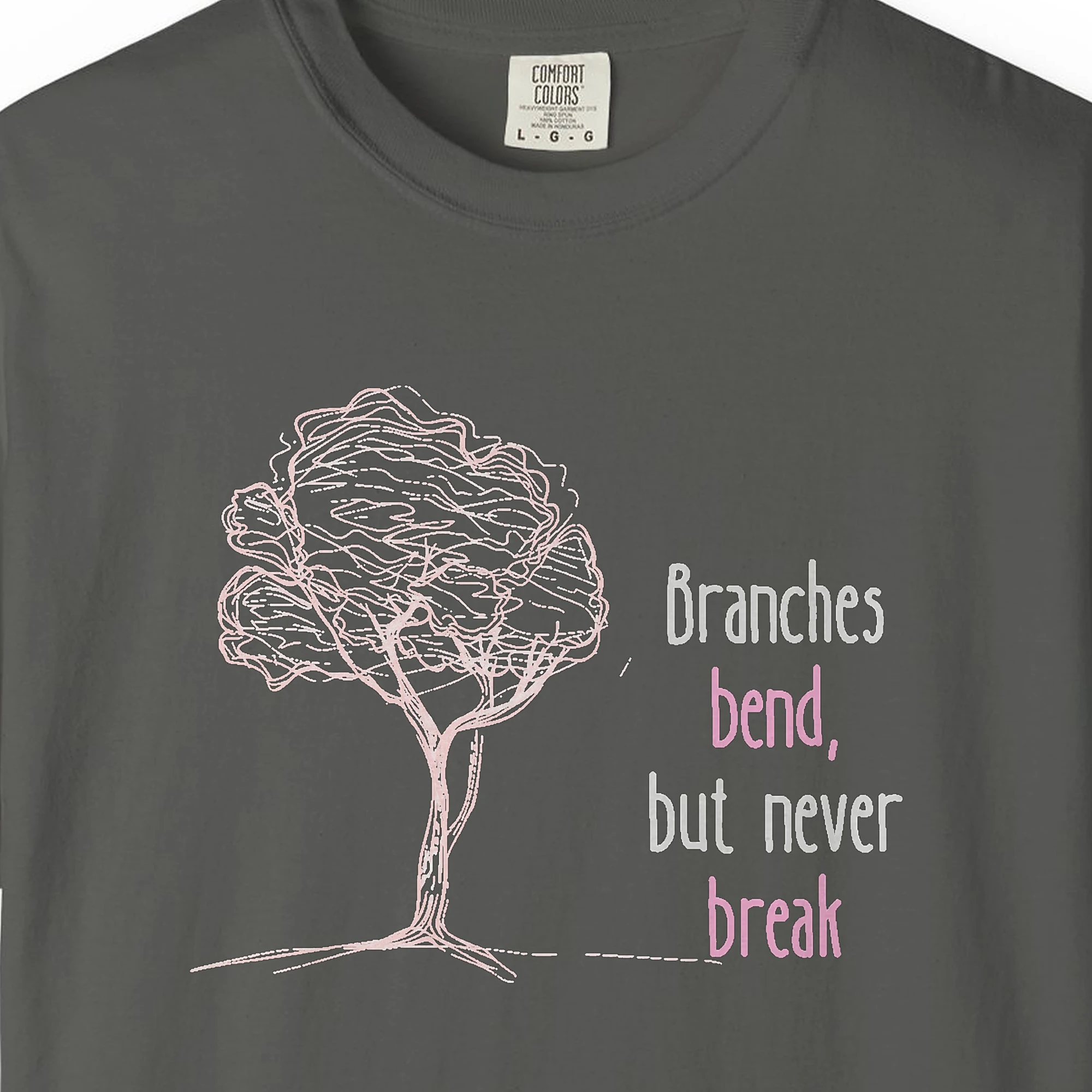 Close-up of the Branches Bend Never Break print on a Pepper Comfort Colors 1717 tee