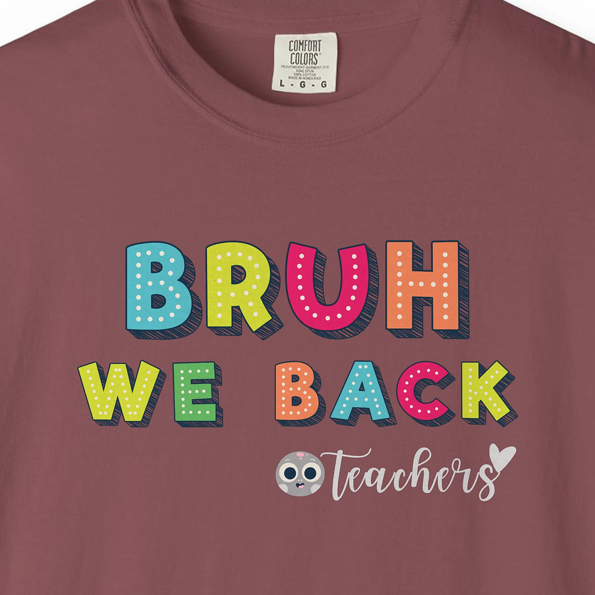 Close-up of the Bruh We Back print on a Brick Comfort Colors 1717 tee