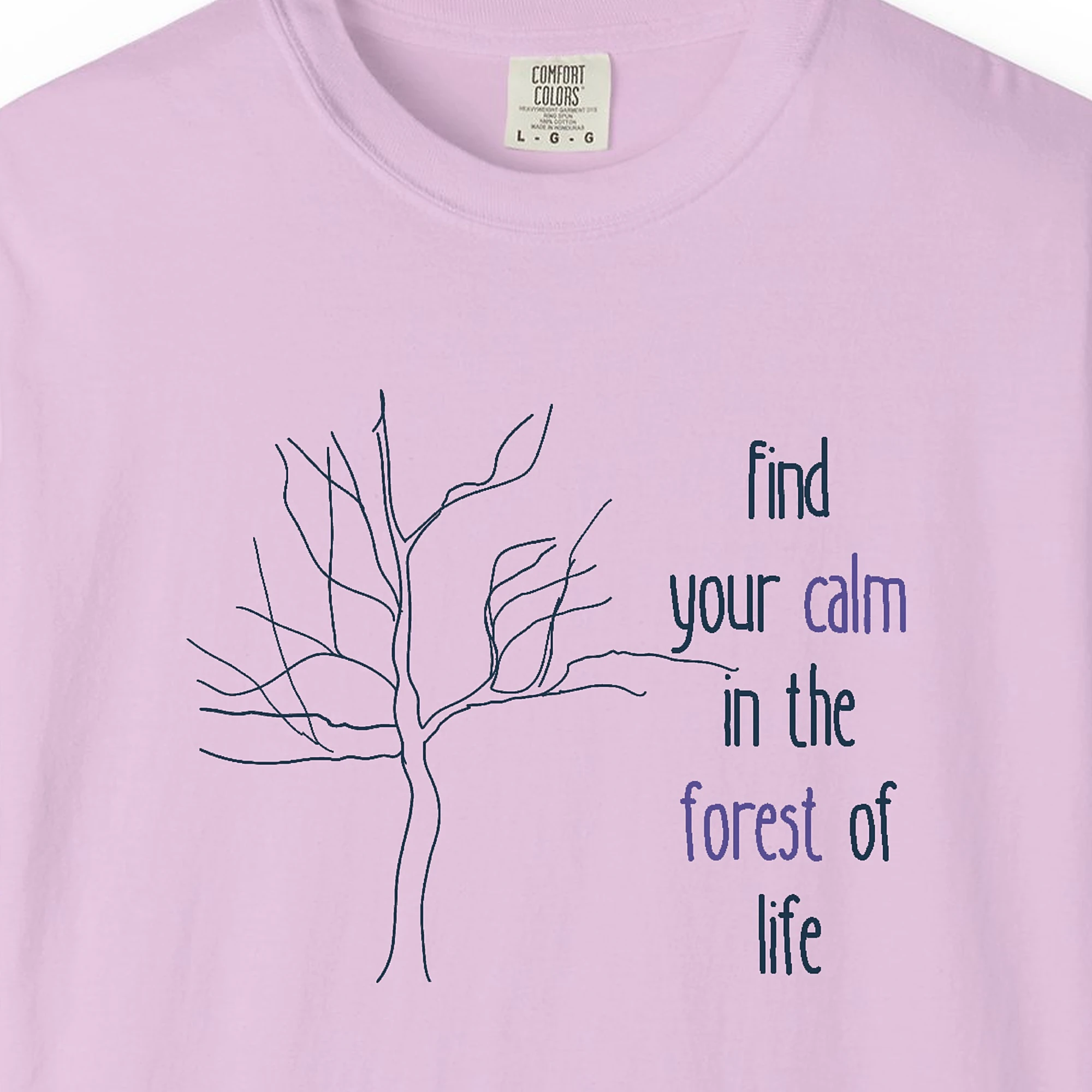 Close-up of the Calm in the Forest print on a Orchid Comfort Colors 1717 tee