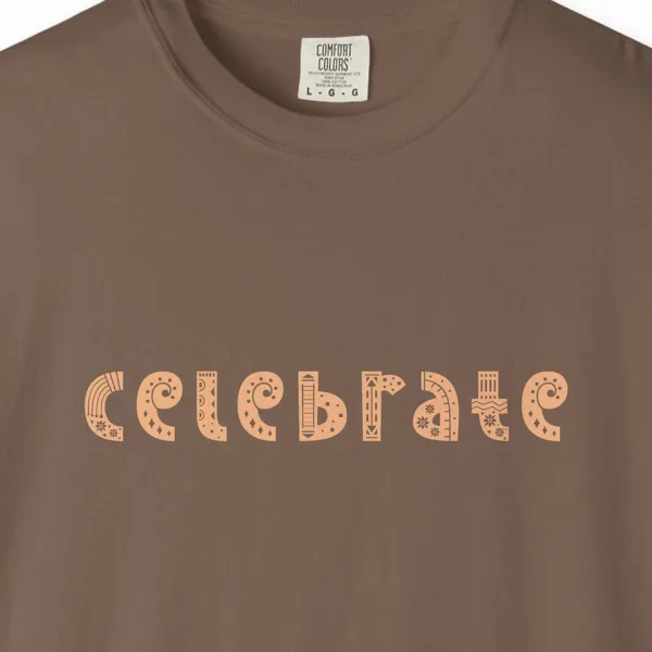 Close-up of the Celebrate print on a Espresso Comfort Colors 1717 tee