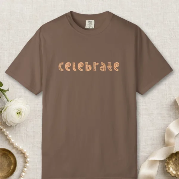 Celebrate design on a Espresso Comfort Colors 1717 tee, laid flat