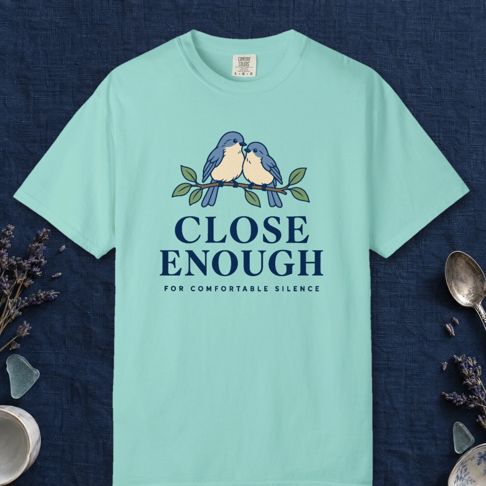 Close Enough design on a Chalky Mint Comfort Colors 1717 tee, laid flat