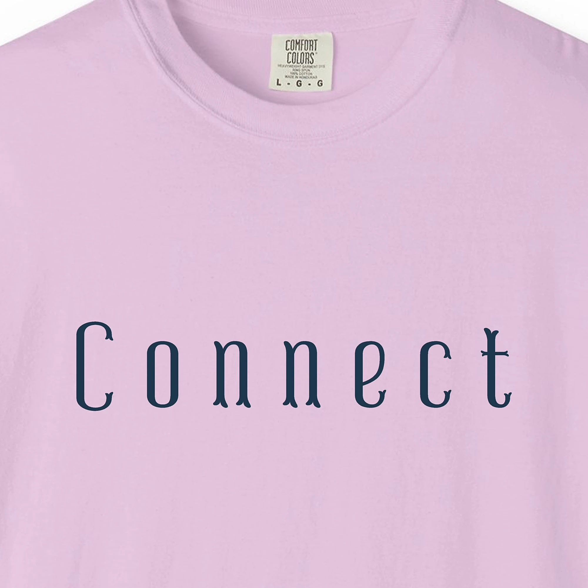 Close-up of the Connect Vintage Letter print on a Orchid Comfort Colors 1717 tee