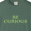 Close-up of the Curious Mind print on a Blue Spruce Comfort Colors 1717 tee