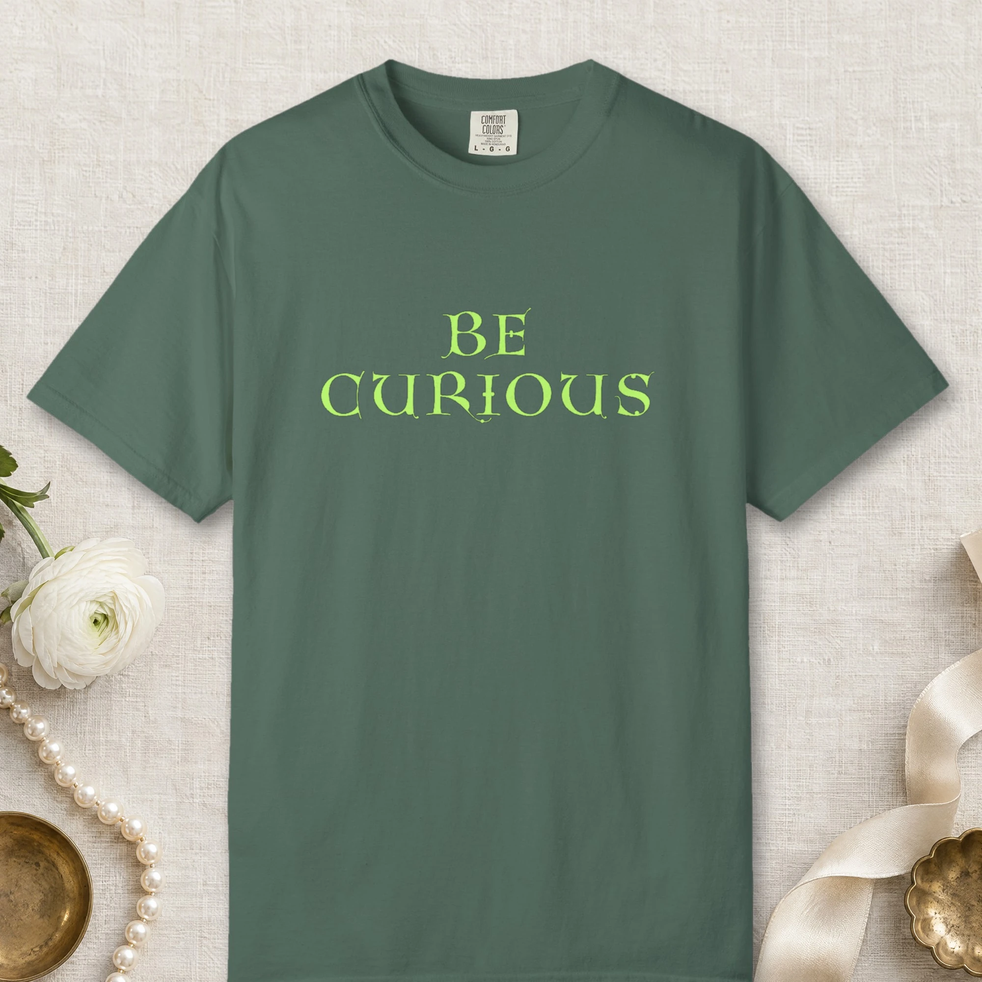 Curious Mind design on a Blue Spruce Comfort Colors 1717 tee, laid flat