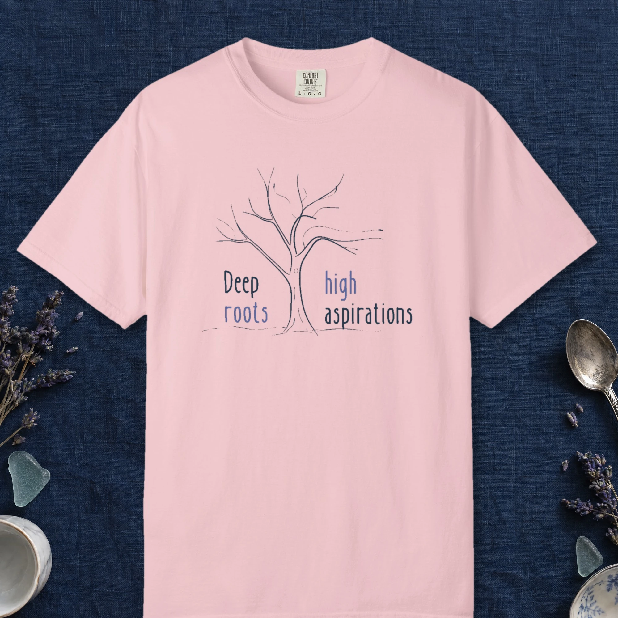 Deep Roots High Aspirations design on a Blossom Comfort Colors 1717 tee, laid flat