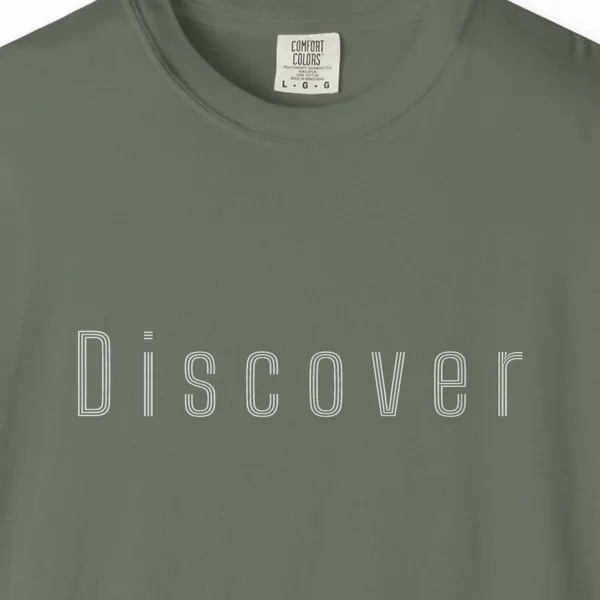Close-up of the Discover Inline print on a Moss Comfort Colors 1717 tee