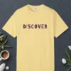 discover-tee-butter-front Discover design on a Butter Comfort Colors 1717 tee, laid flat
