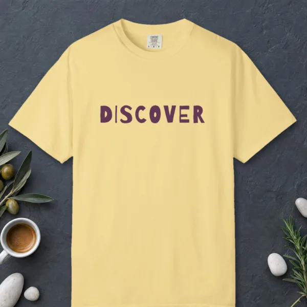 discover-tee-butter-front Discover design on a Butter Comfort Colors 1717 tee, laid flat