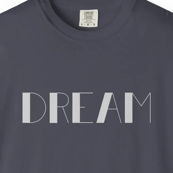 Close-up of the Dream print on a Navy Comfort Colors 1717 tee