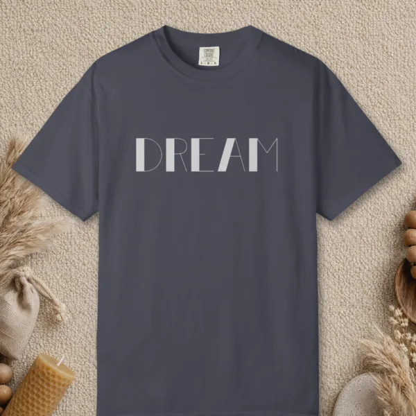 Dream design on a Navy Comfort Colors 1717 tee, laid flat