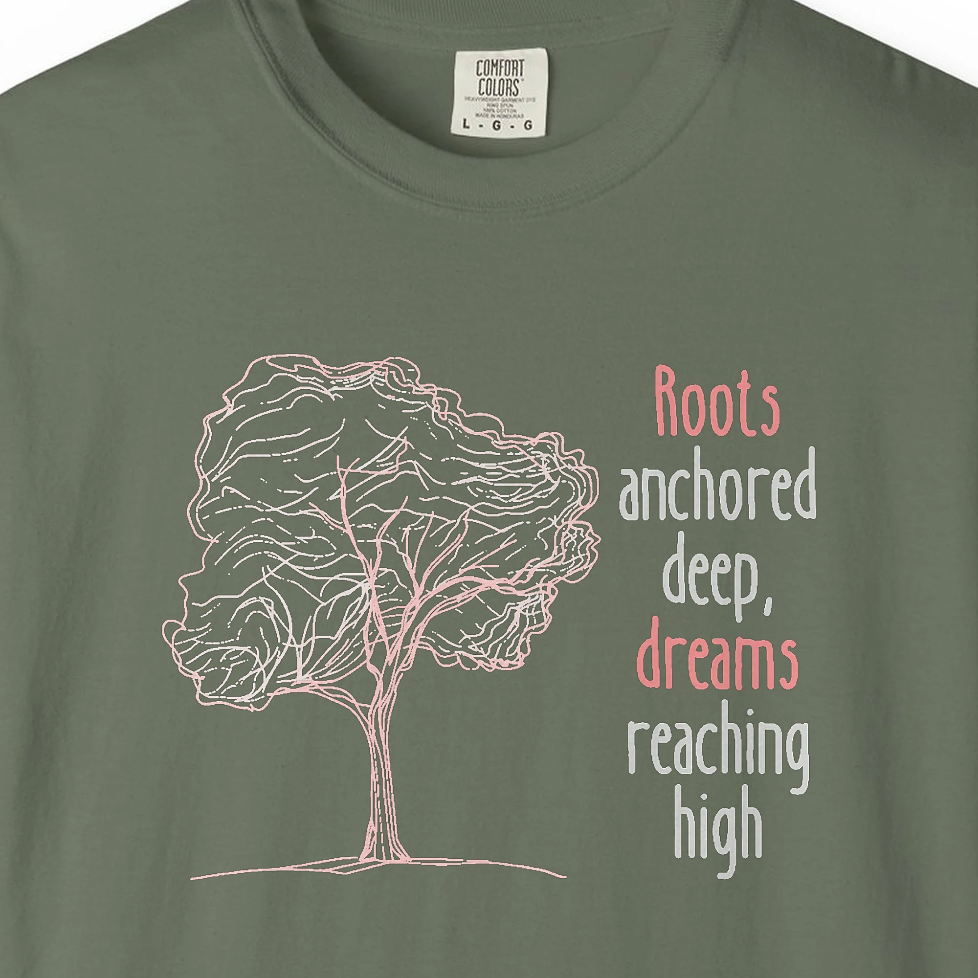 Close-up of the Dreams Reaching High print on a Moss Comfort Colors 1717 tee