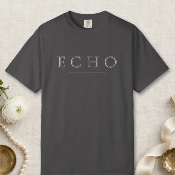 Echo Arrow Line design on a Graphite Comfort Colors 1717 tee, laid flat