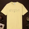 Elegant Outline design on a Butter Comfort Colors 1717 tee, laid flat
