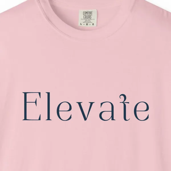 Close-up of the Elevate Serif print on a Blossom Comfort Colors 1717 tee