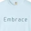 embrace-rounded-tee-chambray-chest Close-up of the Embrace Rounded print on a Chambray Comfort Colors 1717 tee