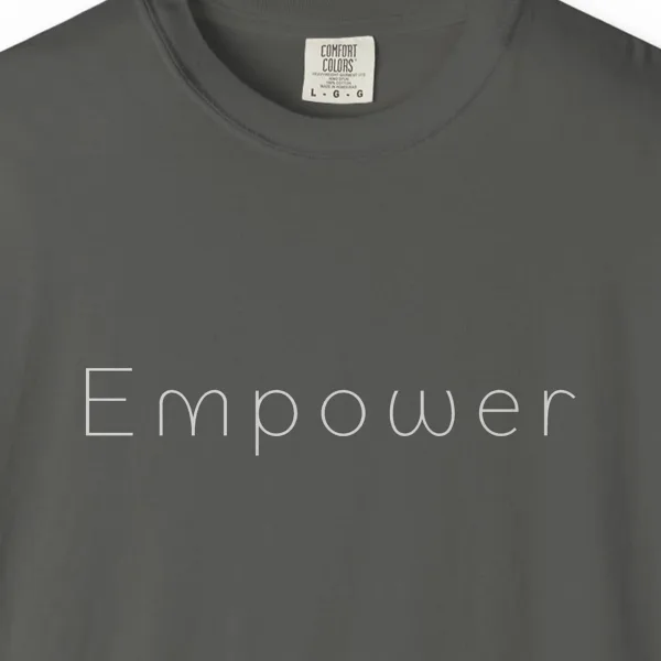 Close-up of the Empower Light Line print on a Pepper Comfort Colors 1717 tee