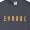 Close-up of the Endure print on a Navy Comfort Colors 1717 tee